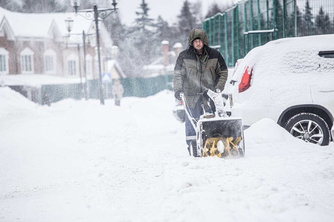 A man using a snow blower